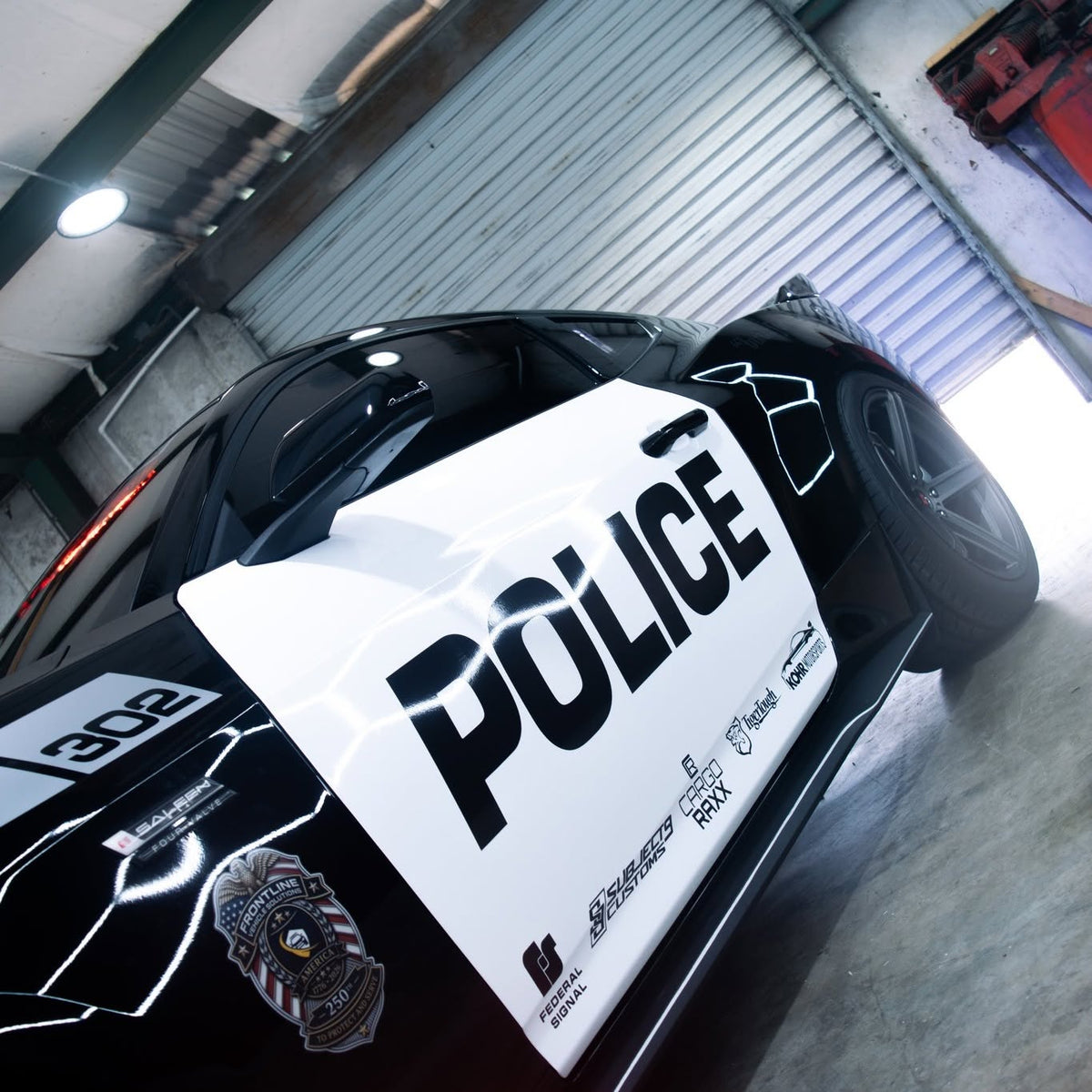 Police-themed Ford Mustang show car with custom graphics, window tint, and ceramic coating by Subject 9 Customs in Cocoa, FL